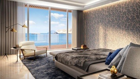 Master bedroom — textured feature wall & sea view