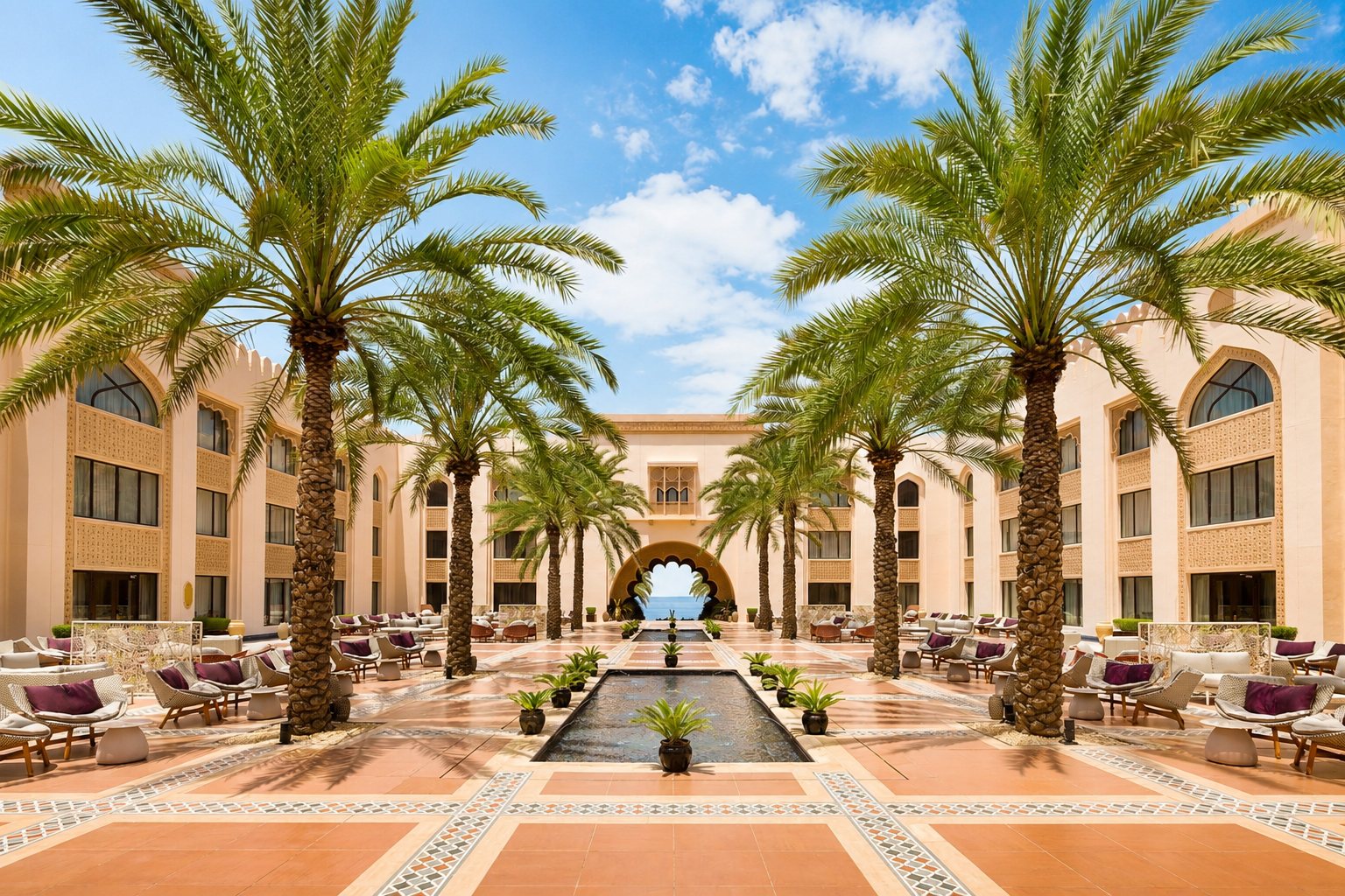 Central courtyard — palm allée & sea-facing water rill