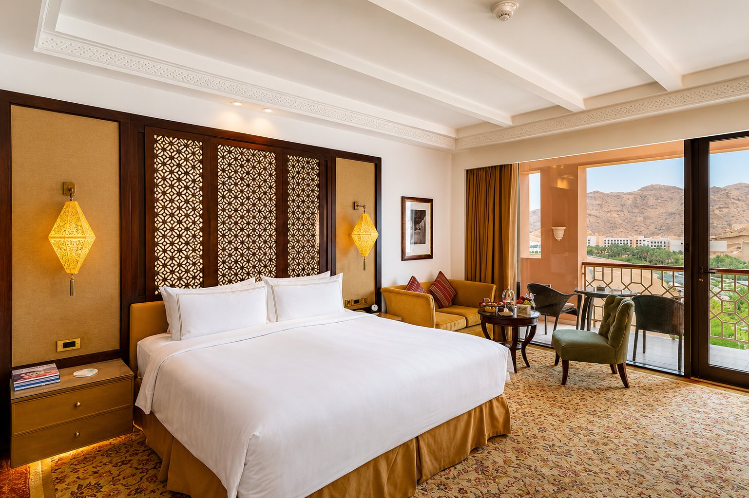 Mountain-view deluxe room — lantern sconces & gold accents