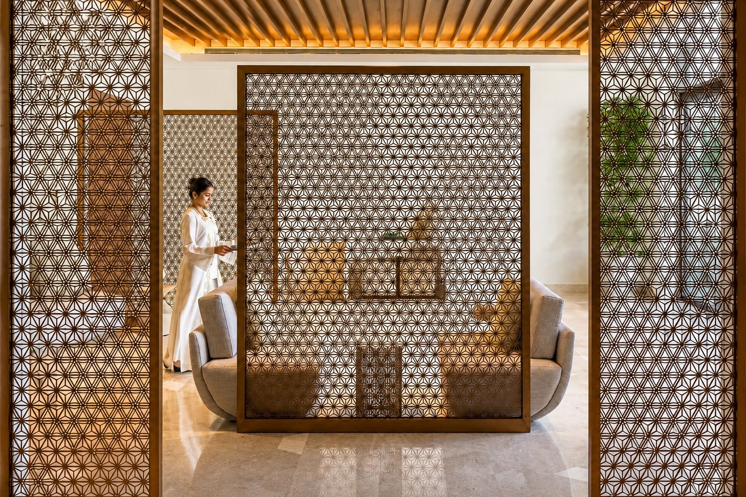 Lounge — laser-cut mashrabiya screens & sculpted timber ceiling