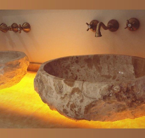 Washroom — artisan stone basins & brass fittings