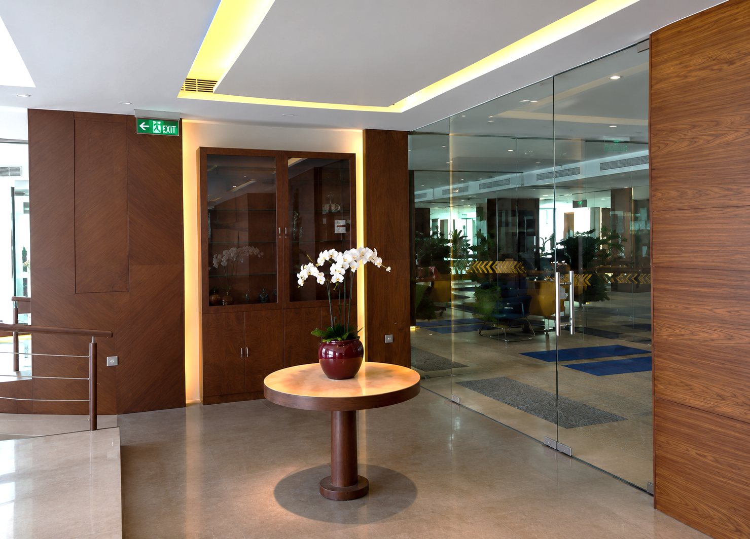 Reception lobby — orchid table & walnut joinery