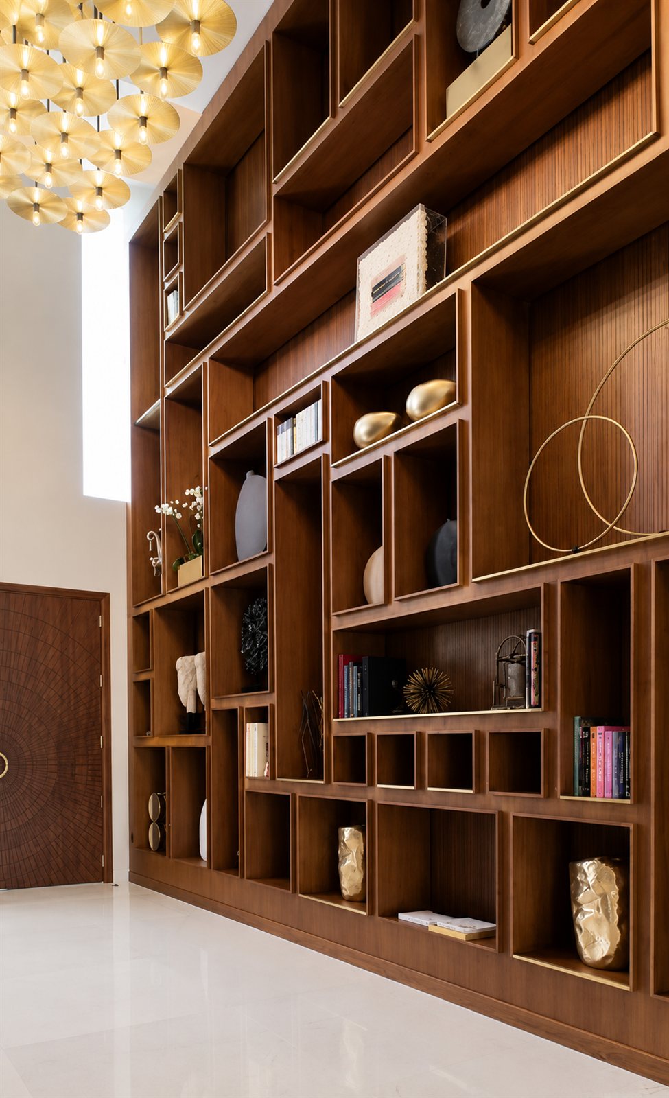 Display wall — walnut joinery & brass inlay