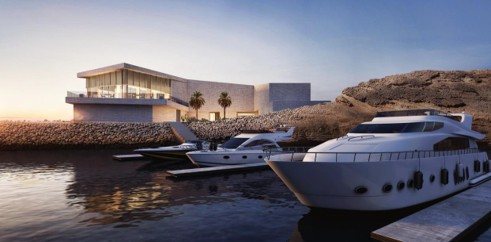 The club at dusk — moored yachts & glowing pavilion
