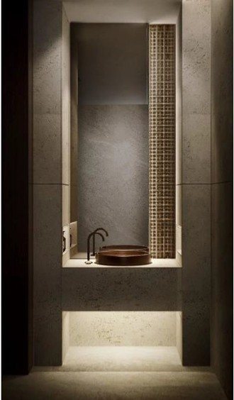Powder room — bronze basin & stone mosaic