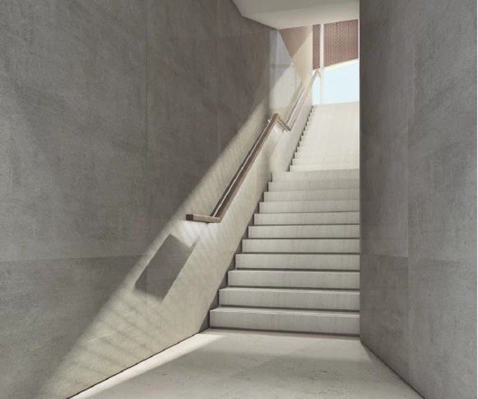 Sculptural stair — daylight & raw stone